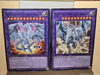 Front view of both cards displaying artwork and stats