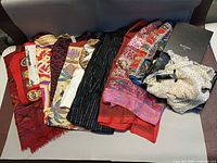 All twelve scarves displayed with Rudsak box and polka-dot scarf