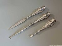All three sterling manicure tools showing full view