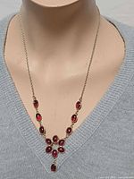 Necklace on mannequin front view showing design and length