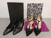 Both pairs of heels with their boxes and dust bag
