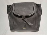 Front view of black pebbled leather Kate Spade Knott backpack