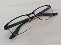 Front angled view showing rectangular shape and nose pads