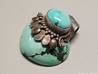Front angled view showing turquoise stones and silver detailing