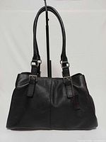 Front view of black pebbled leather Danier satchel showing overall style and condition
