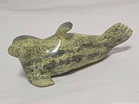 Left side view of soapstone seal sculpture