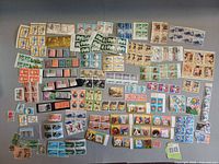 Overall view of entire assortment of stamp sheets and blocks spread out