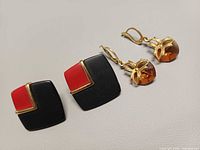 Front view of both earring pairs showing design and colours