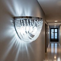 Front view of chrome wall sconce with cascading crystal beads