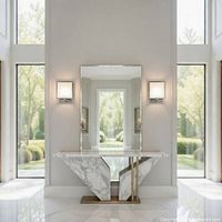 rendered foyer showing square wall sconces on either side of mirror