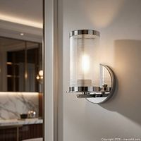 Wall sconce close-up showing chrome finish and mesh cylinder