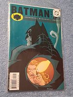 Front view of Batman #597 comic in bag with board