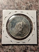 Obverse showing Bluenose schooner legend in 2×2 flip