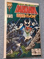 Front cover of bagged and boarded Darkhawk #14 comic featuring Venom