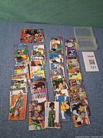 Full lot showing spread of assorted Dragon Ball playing cards and clear storage case