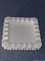 Top view of square dish showing ruffled rim and smooth interior