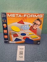 Front of sealed Meta-Forms game box showing contents and branding