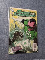 Front cover of Green Lantern #32 in bag with board