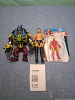 All three action figures side by side with lot number