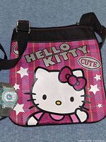 Front view of Hello Kitty crossbody bag with watch for scale