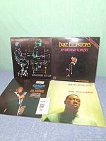 Four album jackets front view