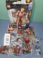 Box, manual, sticker sheet, numbered bags with parts laid out