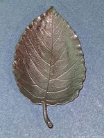 Top view of leaf-shaped metal tray