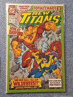 Front cover of bagged The New Titans #91 comic showing characters and title