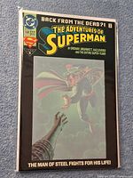 Front cover of bagged comic showing title, artwork, and protective sleeve