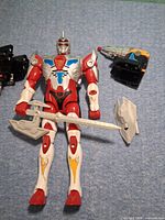 Front view of Ultraman figure with sword, shield and arm blasters