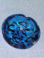Top view of cobalt blue art glass ashtray showing overall shape and color