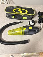 Vacuum, hose, filter, cord and carrying bag overview