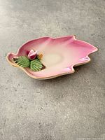 Top view showing leaf shape, pink shading, applied flower and gold rim