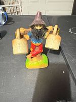 Figurine front view with shakers hanging