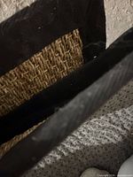 Close-up of seagrass weave and black fabric edge