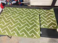 Both rugs laid flat showing pattern and sizes