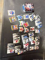 Spread of numerous hockey cards and storage tin