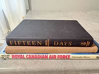 Spine view of all three books stacked