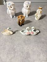 Full group of six animal figurines on tabletop
