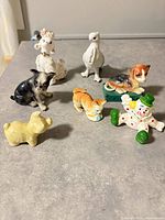Group shot of seven assorted figurines