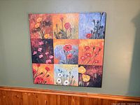 Front view of square multicolor floral canvas art hanging on wall