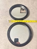 Both round mirrors front view with tape measure showing diameter