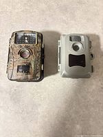 Front view of both trail cameras