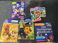 All five books laid out showing covers