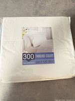 Front view of sealed package showing product label and white sheet