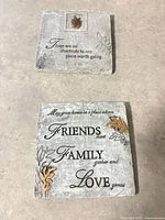 Both resin plaques side by side on surface