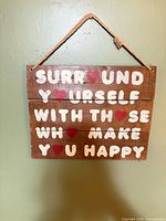 Full view of wooden sign hanging on wall