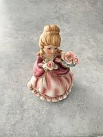 Front view of porcelain girl figurine music box
