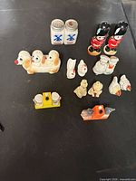 Group shot of all shakers laid out on black surface