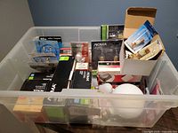Overview of bin with boxed and loose bulbs